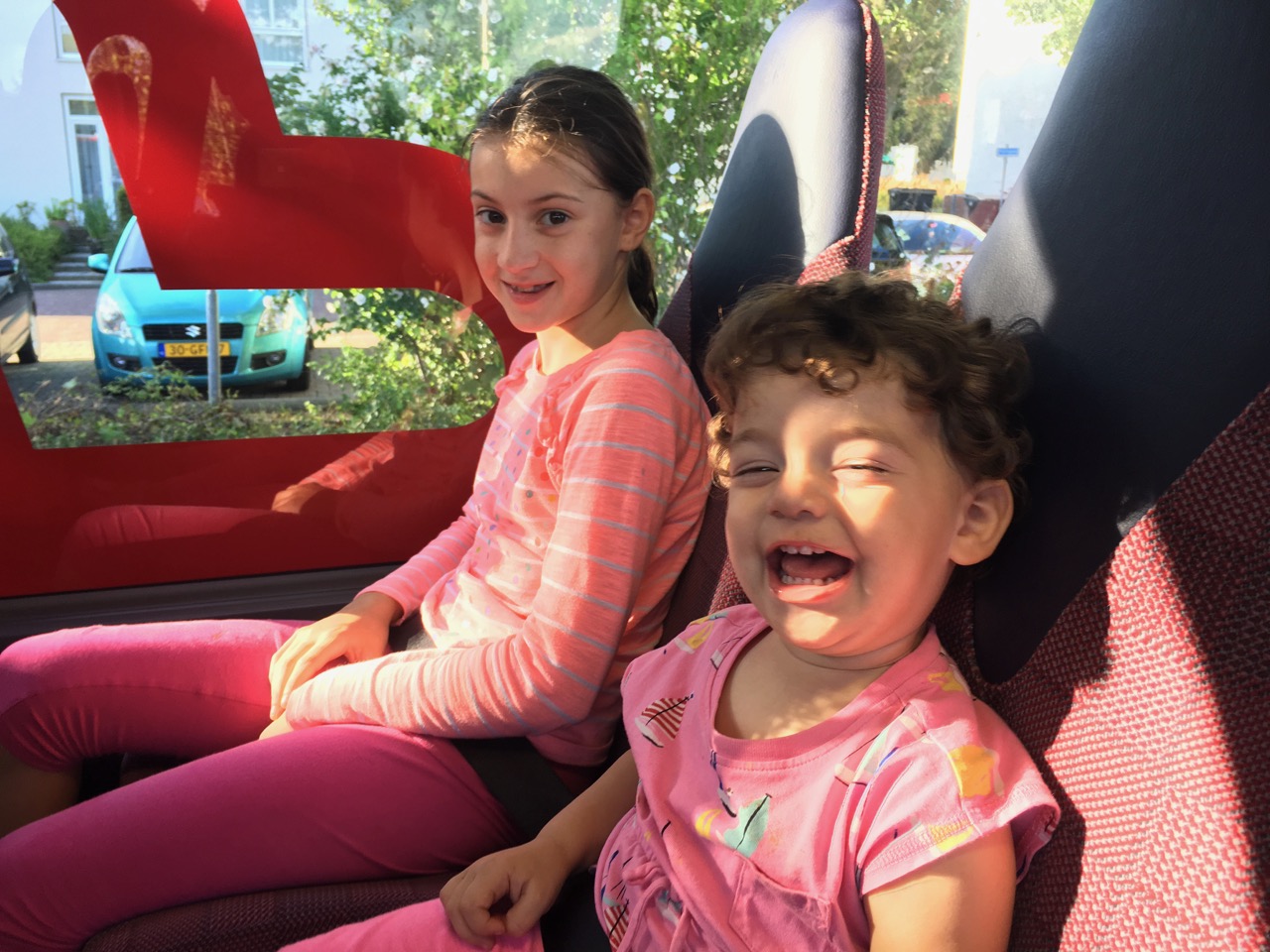 Isabella and Anabella on a Bus